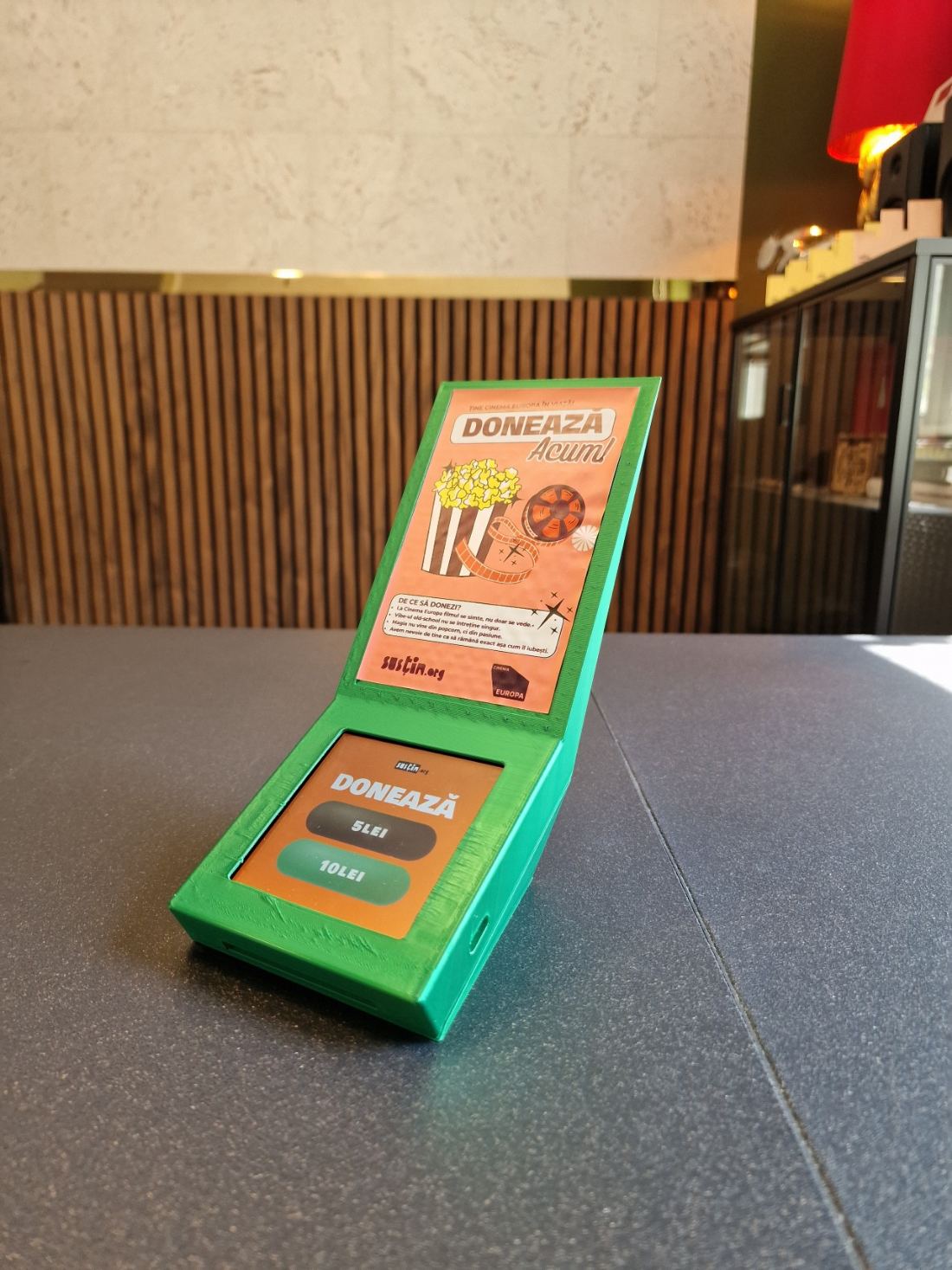 A green box with a message for a cinema project and a built-in screen
