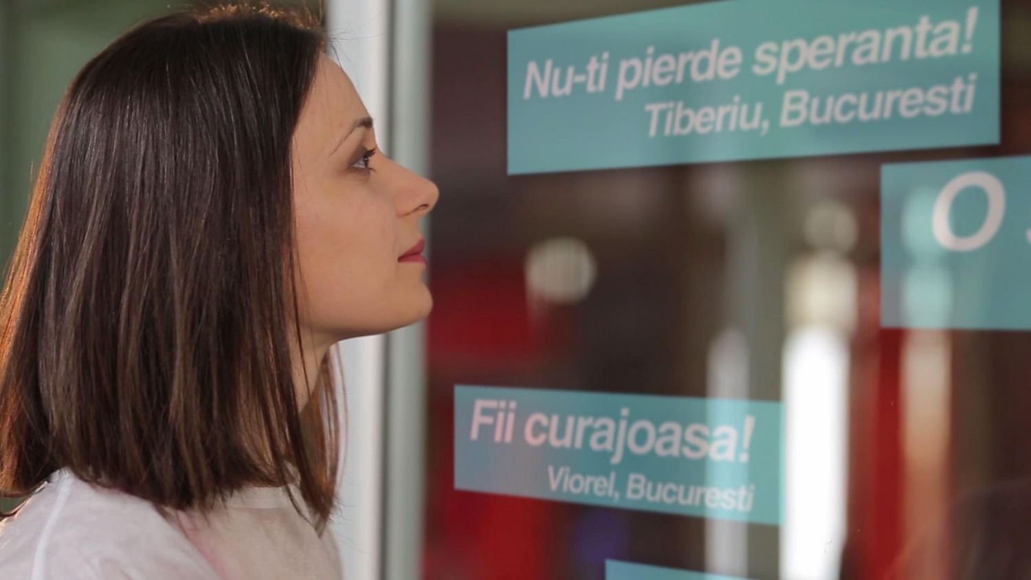 The neonatal unit window, with messages of encouragement projected onto the glass