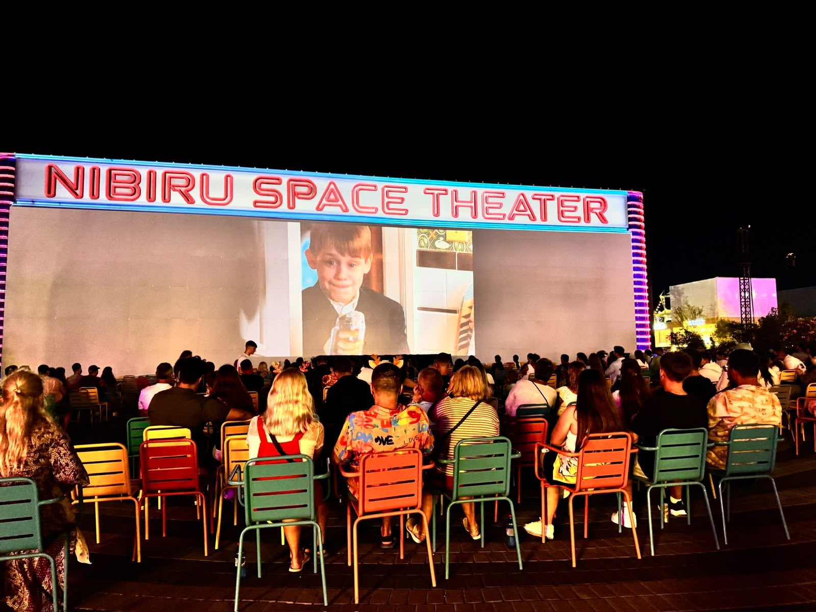 Audience in front of the Nibiru Space Theater screen, during the film